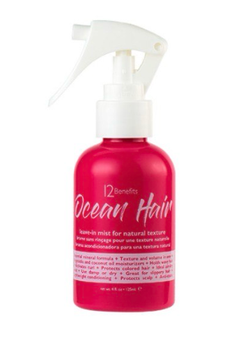 Red spray bottle with white cap labeled 'Ocean Hair' on a white background
